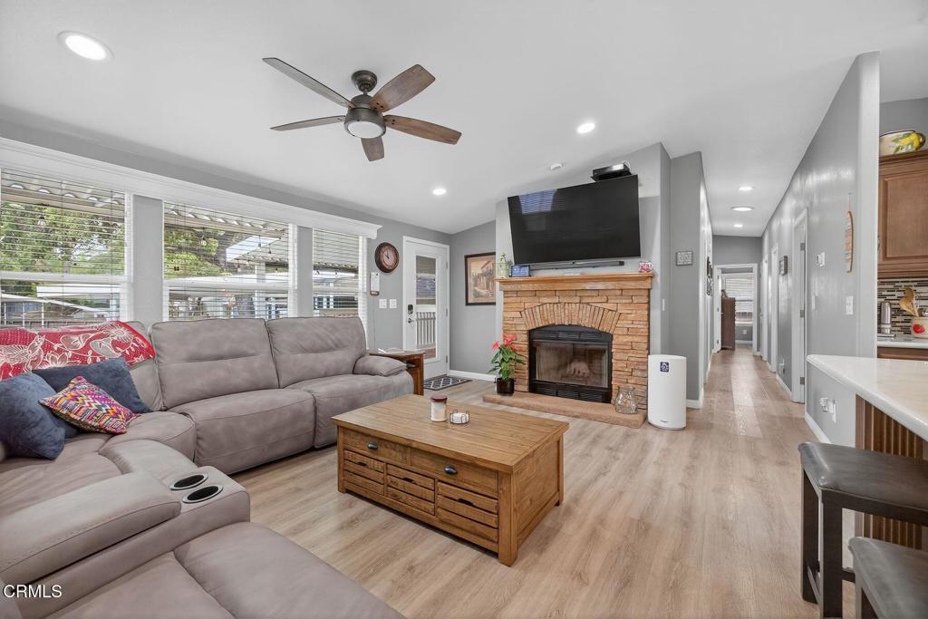 1273 South Rice Road, Unit 53 Ojai, CA 93023 - Photo 3 of 42 a living room with furniture fireplace and a flat screen tv