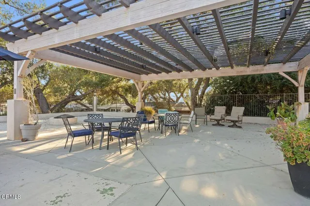a view of a chair and table in the patio