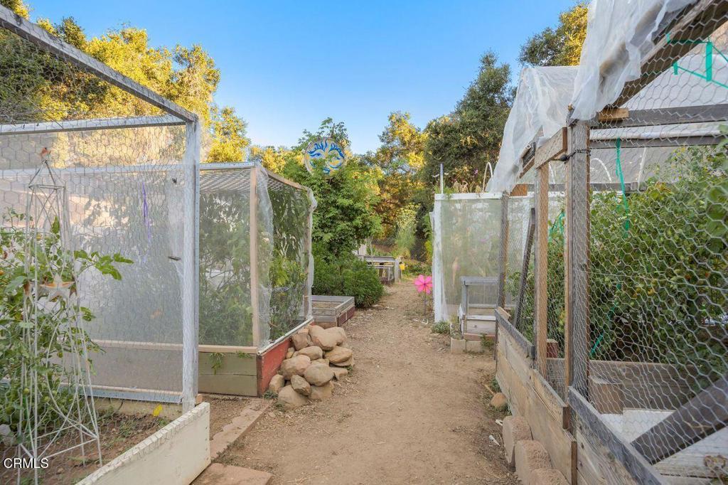 1273 South Rice Road, Unit 53 Ojai, CA 93023 - Photo 34 of 42 a view of a chair and table in the patio