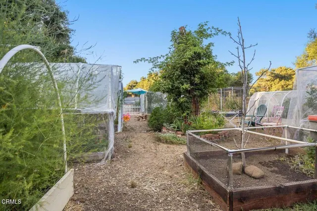 a view of a house with swimming pool and porch