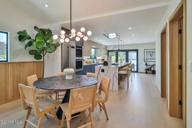 a kitchen with stove and cabinets