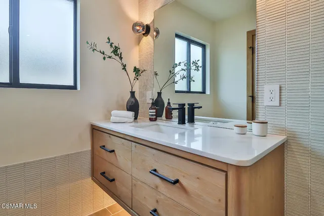 a white bath tub sitting in a bathroom