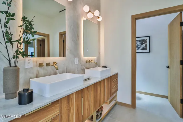 a view of a patio with couches and a table and chairs with the couches