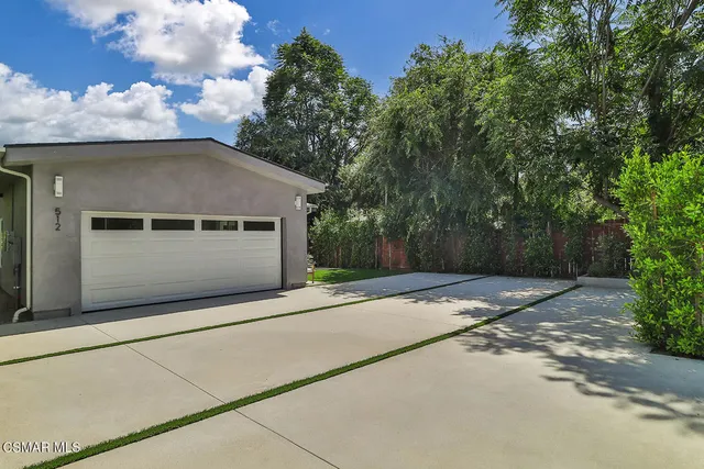 a bathroom with a granite countertop toilet a sink and bathtub