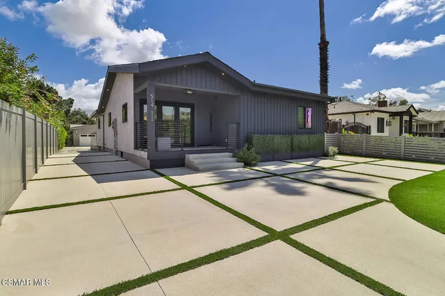 a living room with fireplace furniture and a flat screen tv