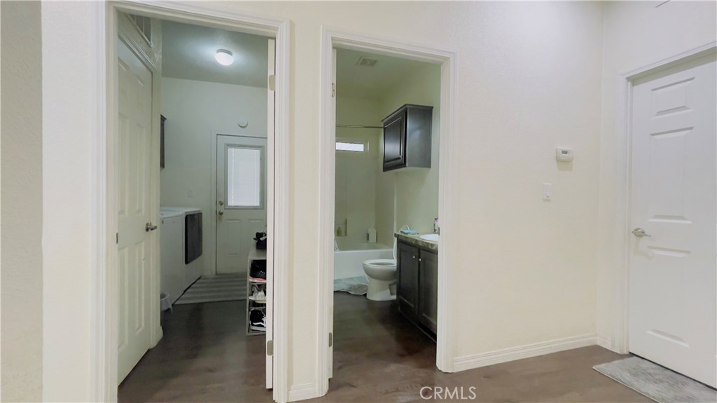 2139 East 4th Street, Unit 142 Ontario, CA 91764 - Photo 15 of 34 a bathroom with a toilet sink and a mirror