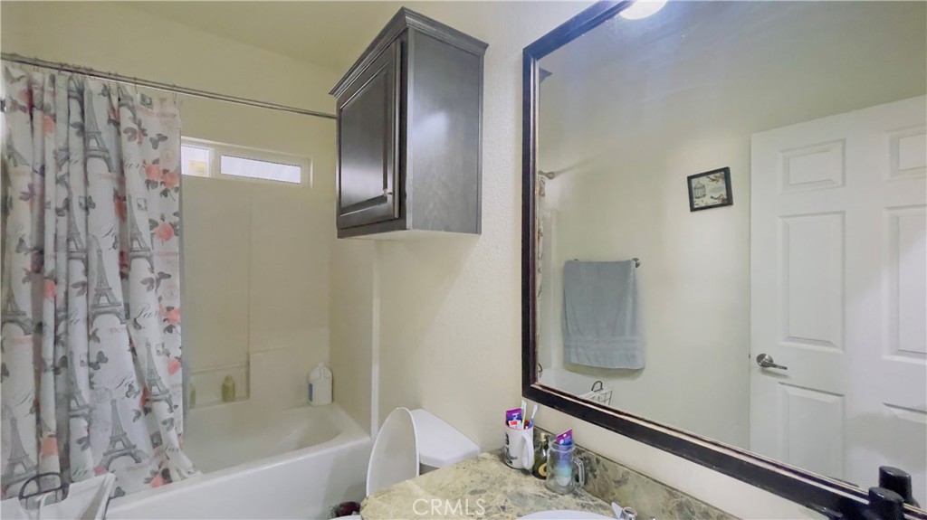 2139 East 4th Street, Unit 142 Ontario, CA 91764 - Photo 21 of 34 a bathroom with a bathtub and a shower