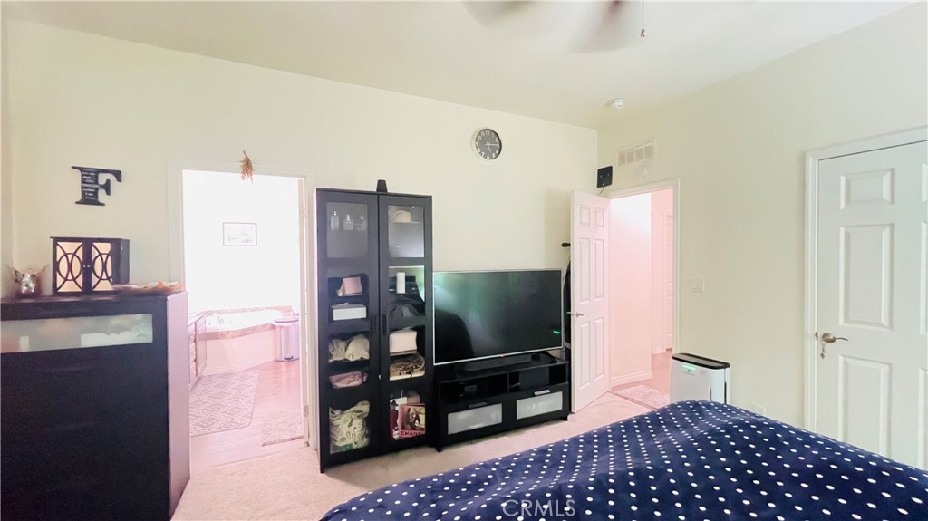 2139 East 4th Street, Unit 142 Ontario, CA 91764 - Photo 25 of 34 a living room with furniture and a flat screen tv