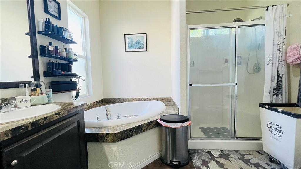 2139 East 4th Street, Unit 142 Ontario, CA 91764 - Photo 27 of 34 a bathroom with a sink toilet and shower