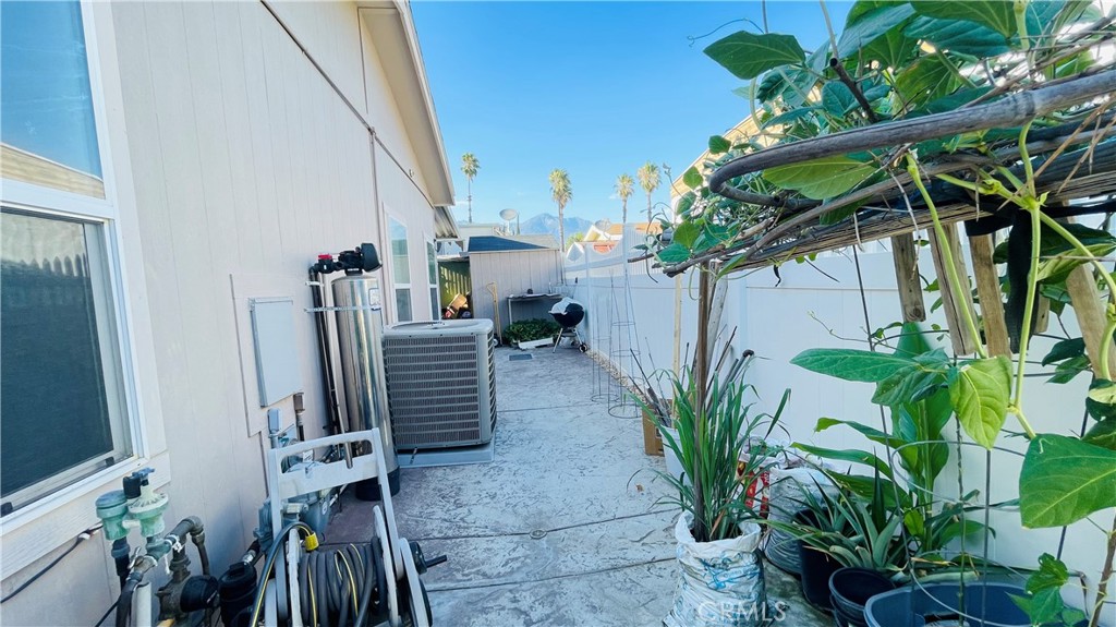 2139 East 4th Street, Unit 142 Ontario, CA 91764 - Photo 30 of 34 a view of a house with a potted plant