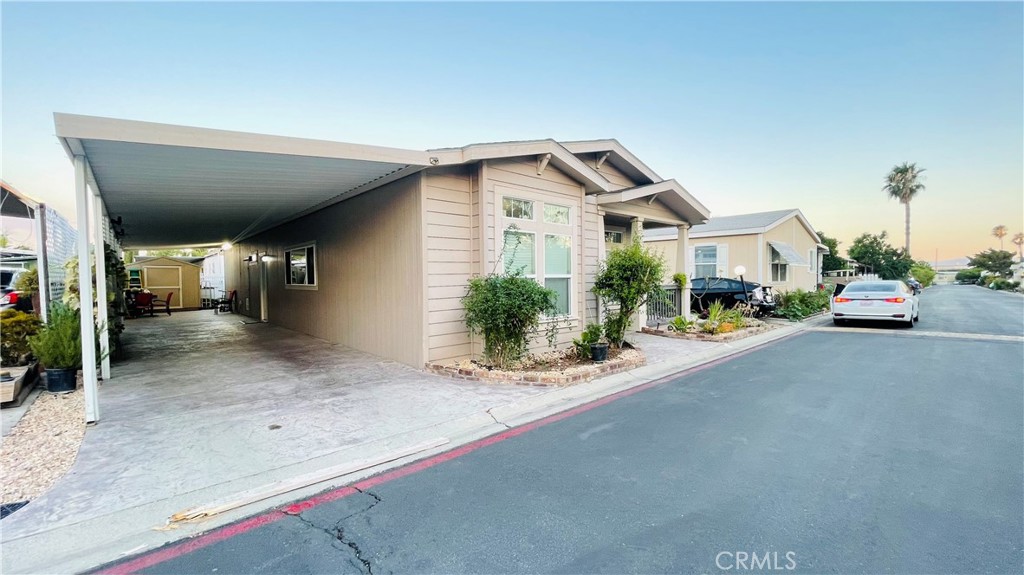 2139 East 4th Street, Unit 142 Ontario, CA 91764 - Photo 3 of 34 a car parked in front of house