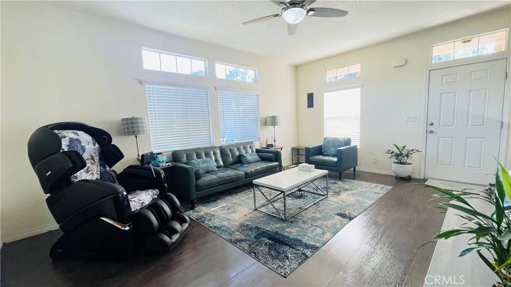 2139 East 4th Street, Unit 142 Ontario, CA 91764 - Photo 8 of 34 a living room with furniture and a chandelier