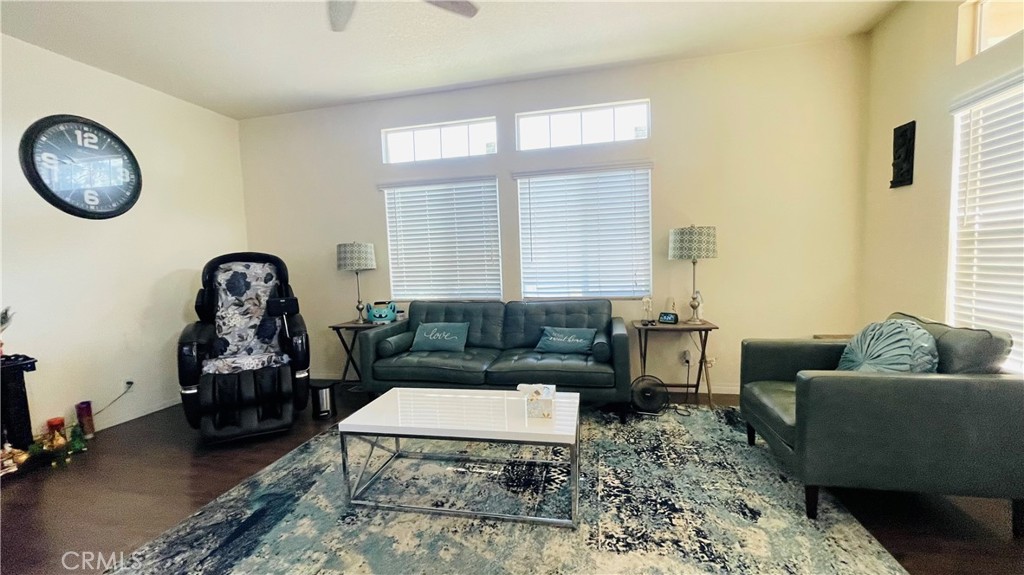 2139 East 4th Street, Unit 142 Ontario, CA 91764 - Photo 9 of 34 a living room with furniture and a wooden floor