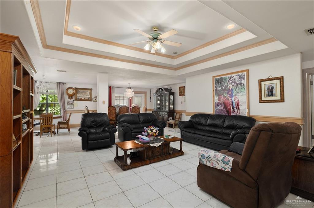 6610 West Mile 2 Road Mission, TX 78574 - Photo 4 of 18 a living room with furniture and a chandelier