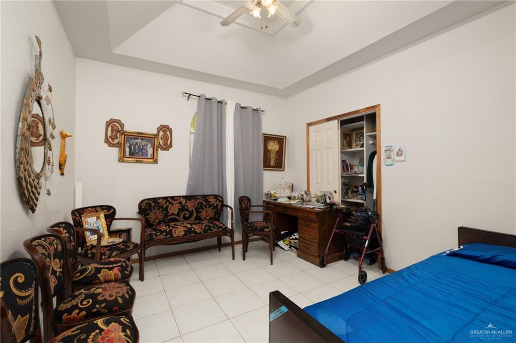 6610 West Mile 2 Road Mission, TX 78574 - Photo 8 of 18 a bedroom with furniture and wooden floor