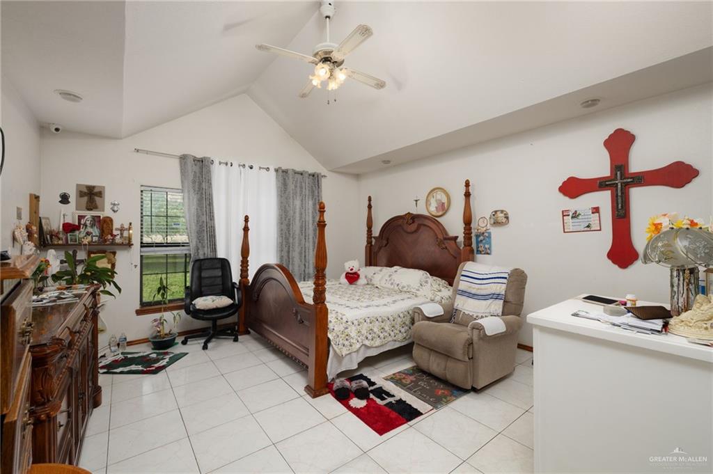 6610 West Mile 2 Road Mission, TX 78574 - Photo 10 of 18 a bedroom with furniture and a window
