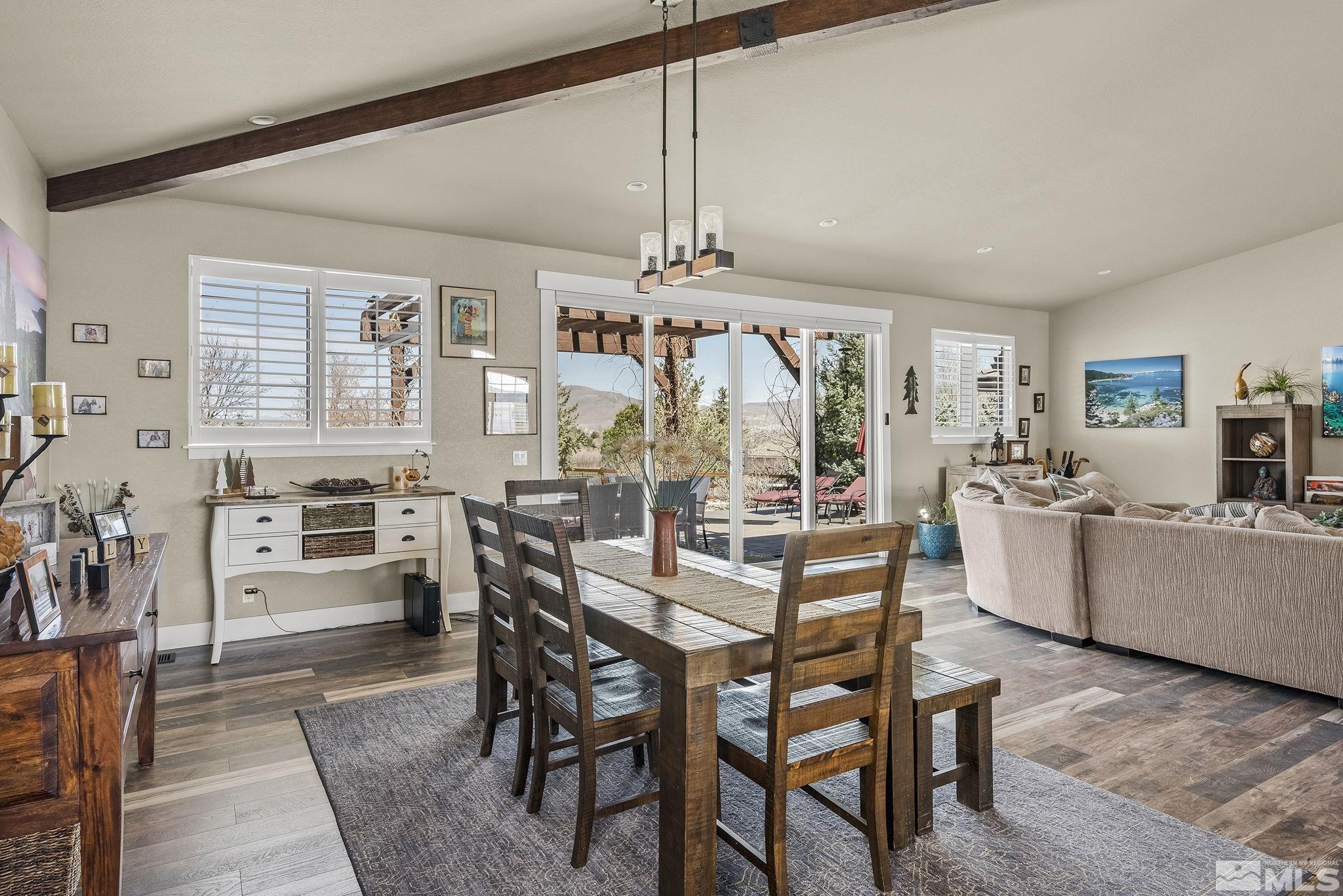 735 Flanders Road Reno, NV 89511 - Photo 12 of 40 a view of a dining room with furniture window and outside view