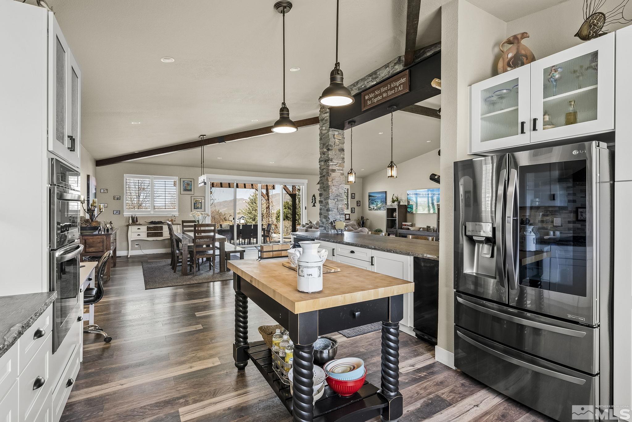 735 Flanders Road Reno, NV 89511 - Photo 18 of 40 a view of a kitchen with dining table and chairs