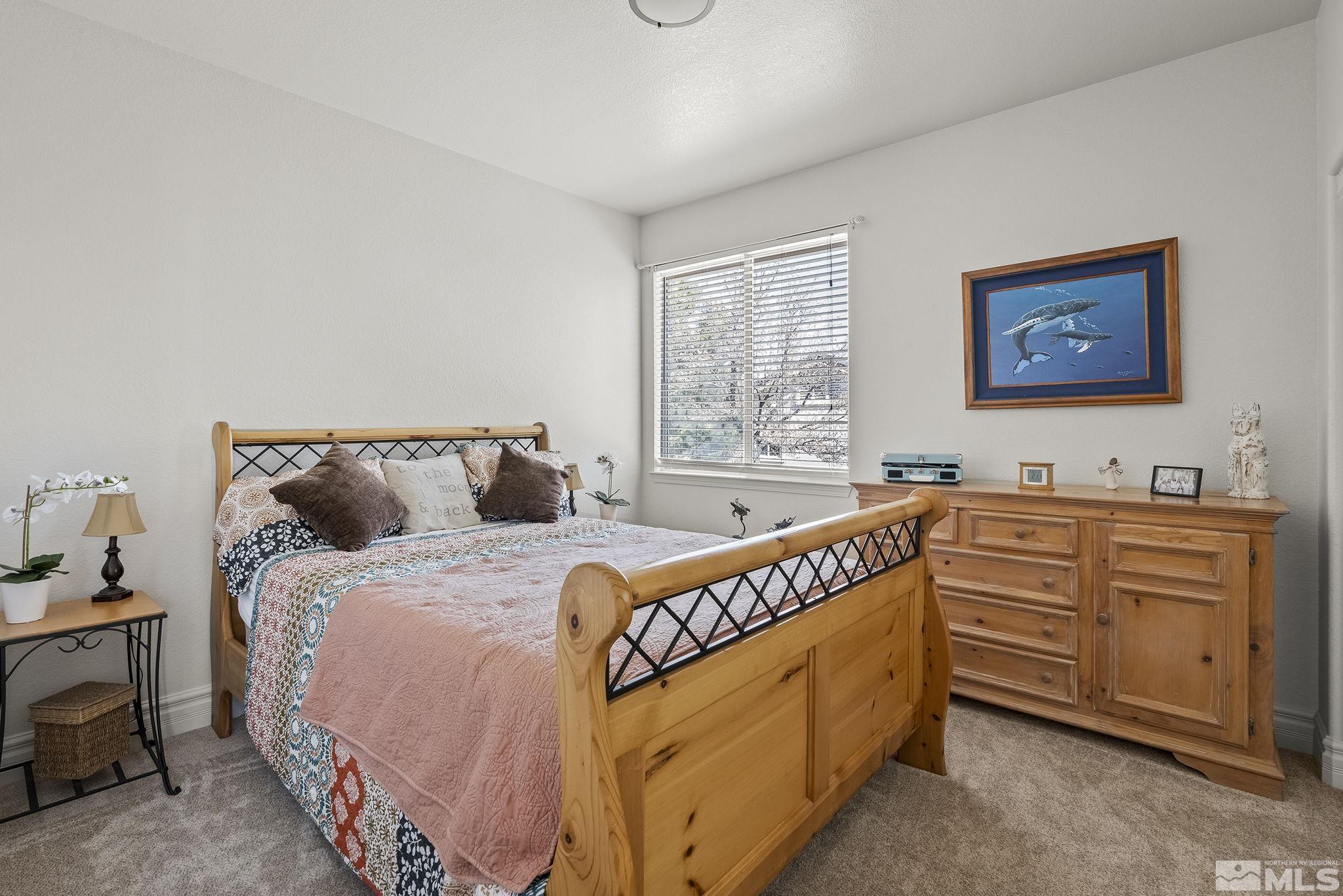 735 Flanders Road Reno, NV 89511 - Photo 24 of 40 a bedroom with bed and window