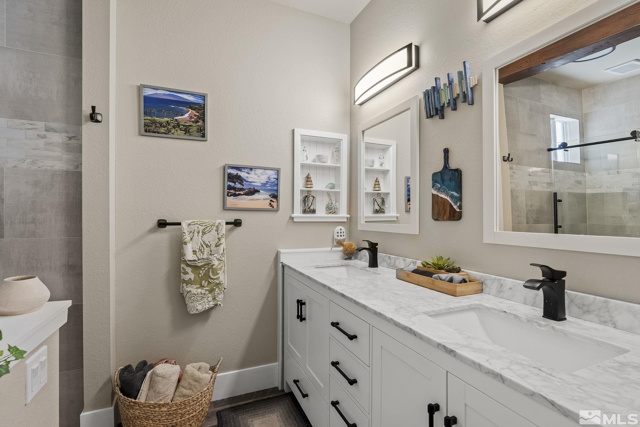 735 Flanders Road Reno, NV 89511 - Photo 27 of 40 a bathroom with a sink and a mirror