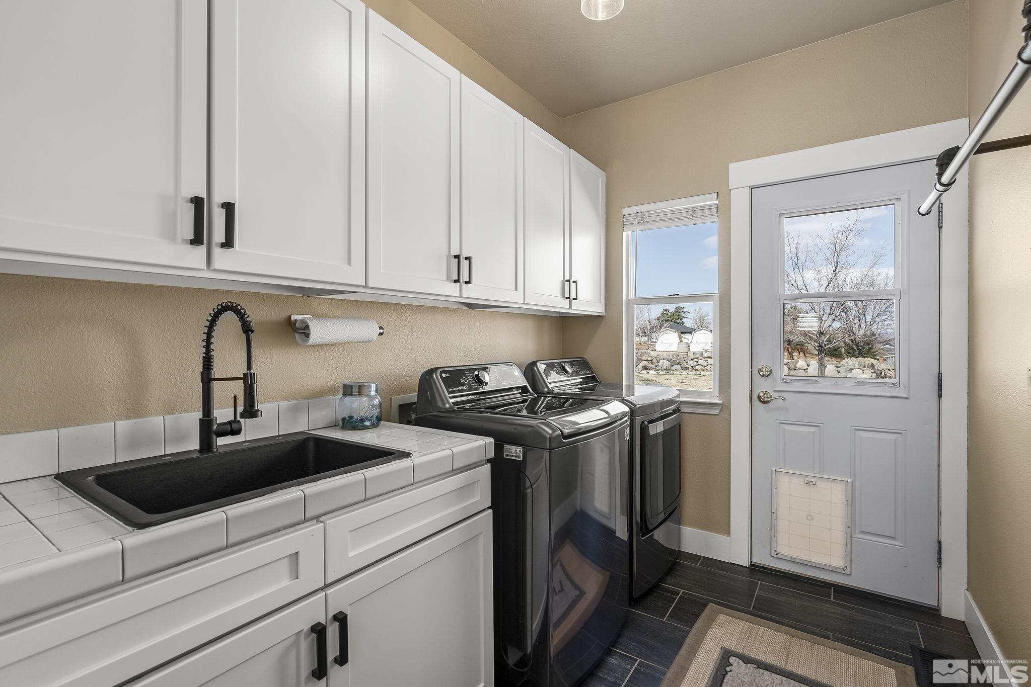 735 Flanders Road Reno, NV 89511 - Photo 28 of 40 a kitchen with stainless steel appliances granite countertop a sink stove and refrigerator