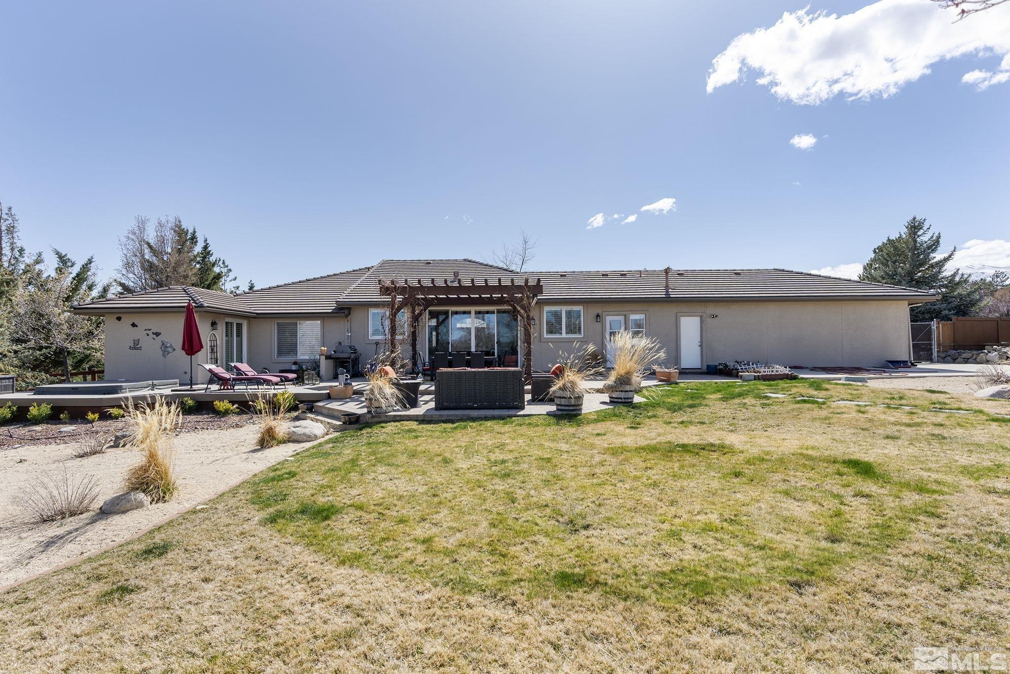 735 Flanders Road Reno, NV 89511 - Photo 30 of 40 a view of a house with swimming pool and sitting area
