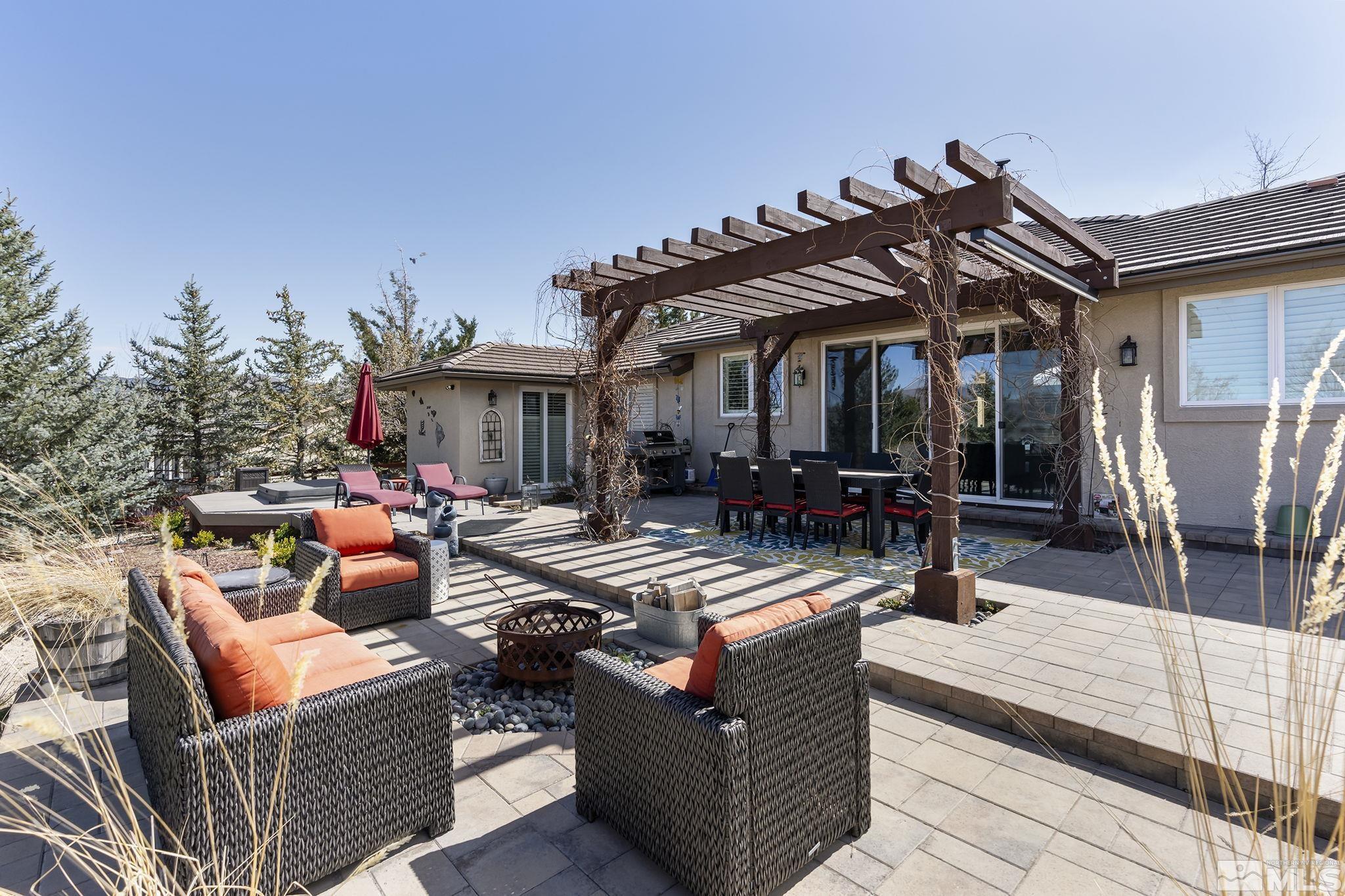 735 Flanders Road Reno, NV 89511 - Photo 31 of 40 a view of a dinning table and chairs in the patio