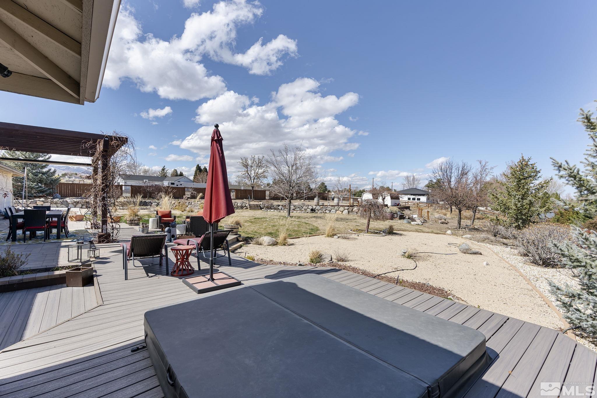 735 Flanders Road Reno, NV 89511 - Photo 33 of 40 a view of roof deck with dining table and chairs