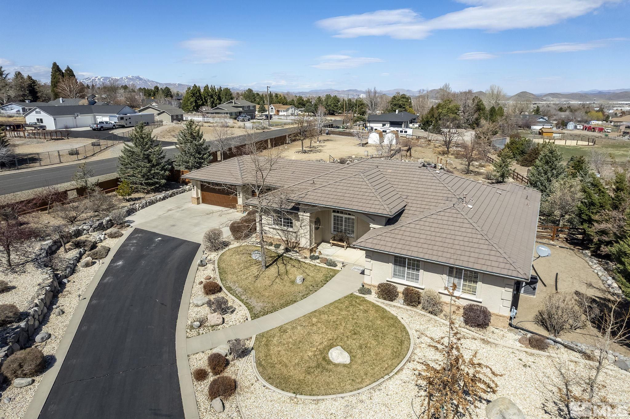 735 Flanders Road Reno, NV 89511 - Photo 35 of 40 an aerial view of a house with swimming pool and ocean view