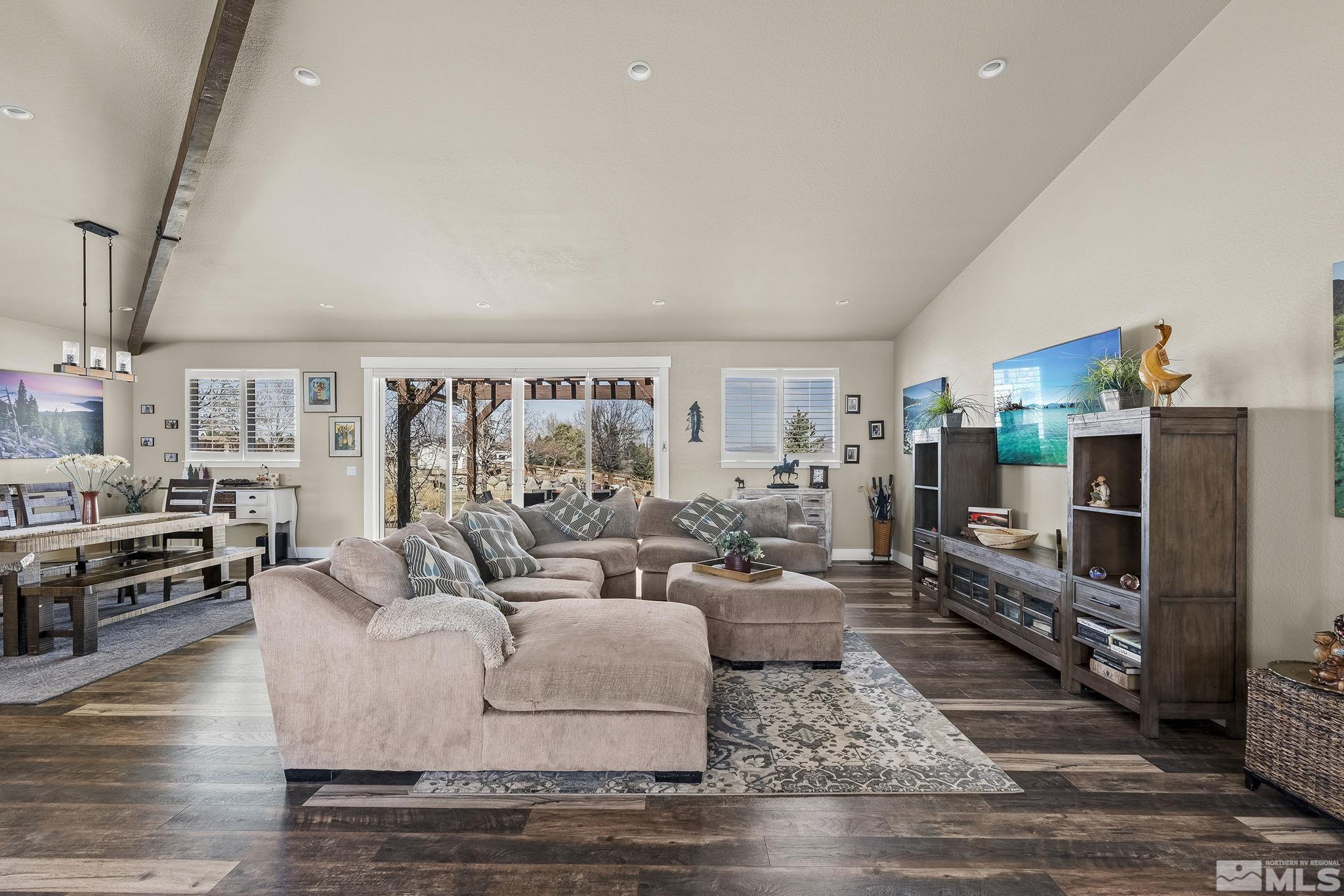 735 Flanders Road Reno, NV 89511 - Photo 6 of 40 a living room with furniture and a flat screen tv