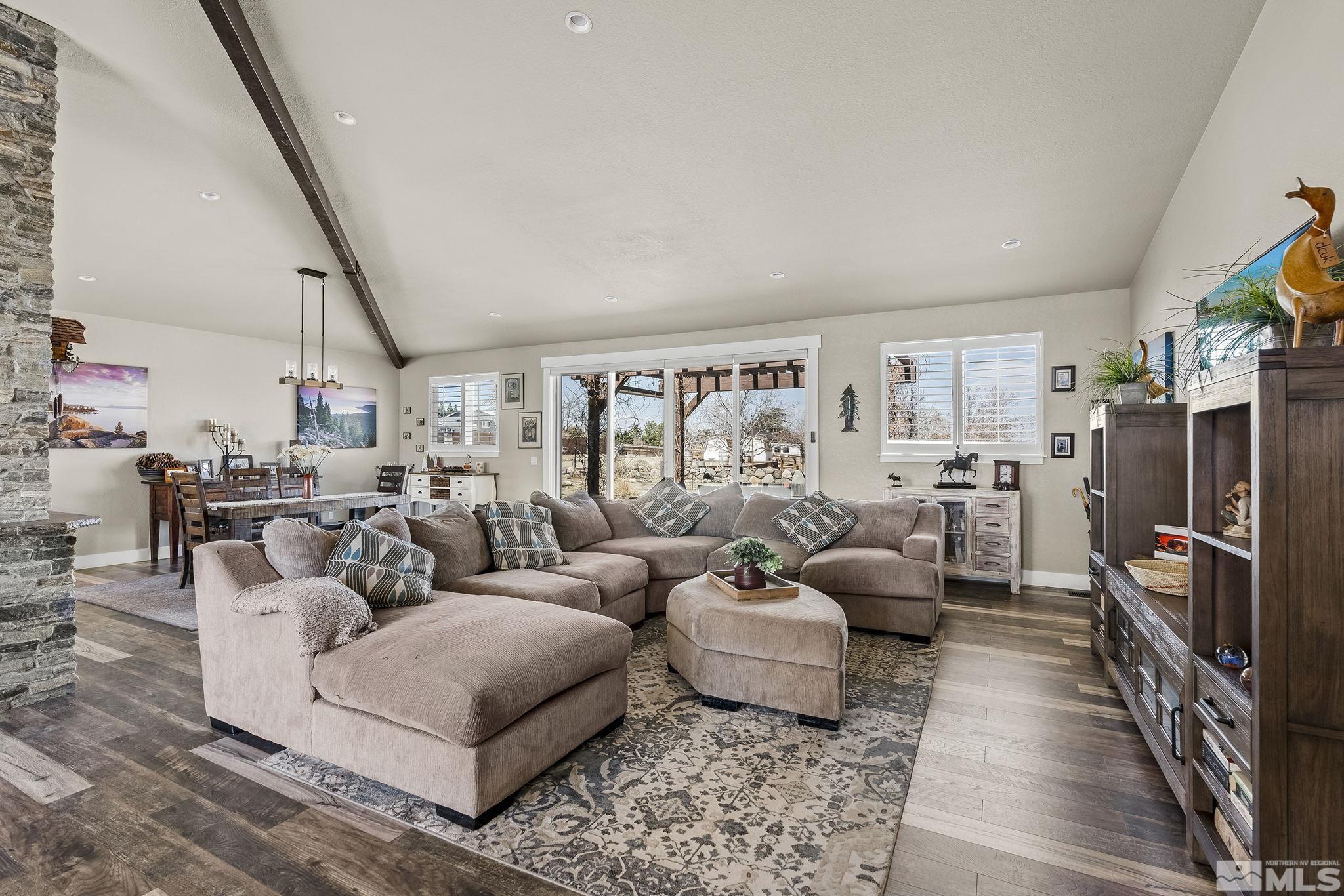735 Flanders Road Reno, NV 89511 - Photo 7 of 40 a living room with furniture and a flat screen tv