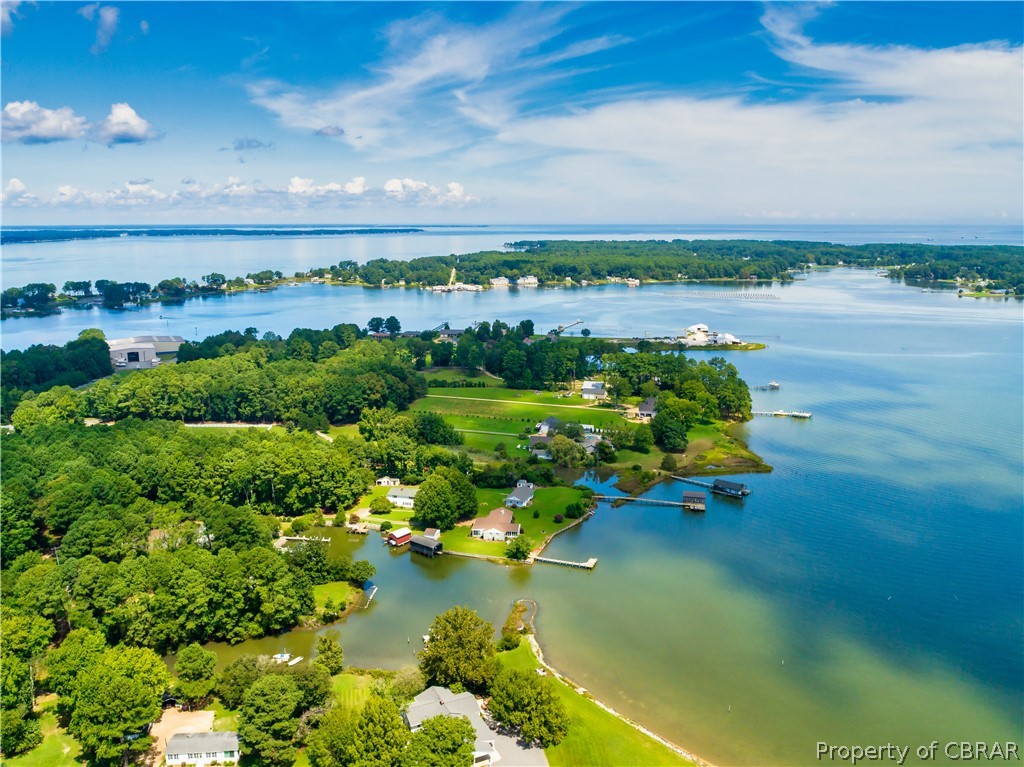 351 Reeves Road Hudgins, VA 23076 - Photo 6 of 41 a view of a lake with houses in the back