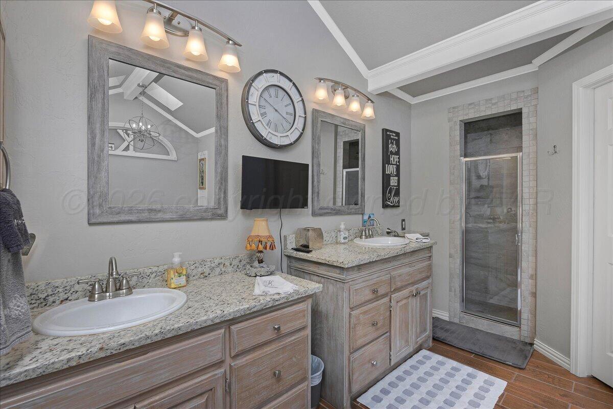 5 Locke Place Amarillo, TX 79124 - Photo 21 of 53 a bathroom with a sink and a mirror