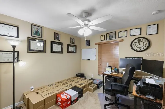 a bedroom with a bed and a desk