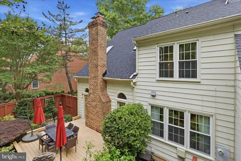 front view of a house with a tree