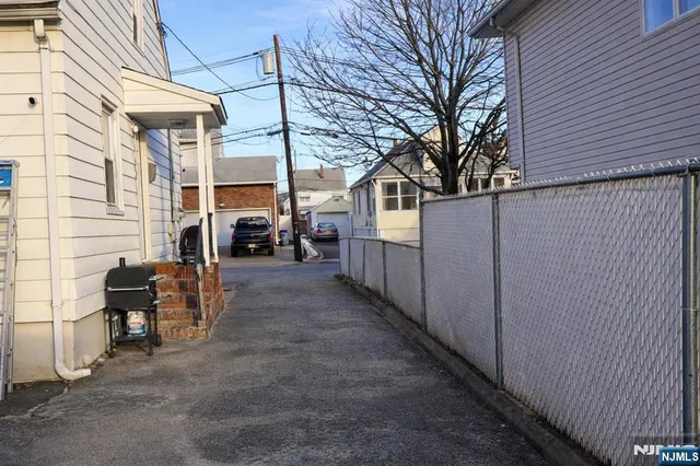 a view of a backyard with sitting area