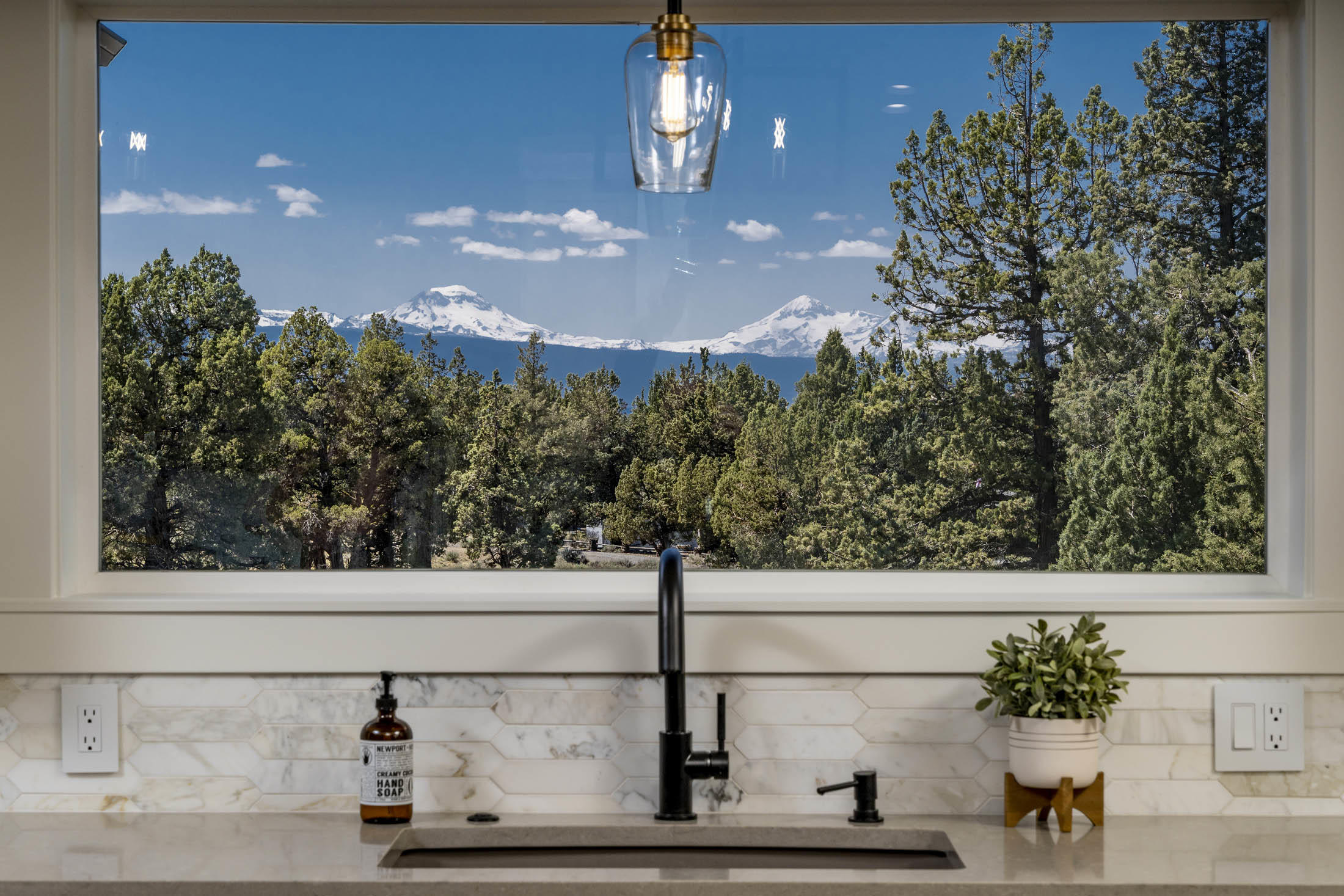 64486 McGrath Road Bend, OR 97701 - Photo 12 of 38 JeldWen windows throughout home. View from upstairs kitchen sink