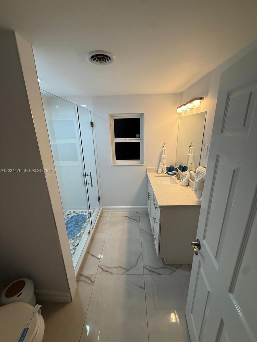 2212 Club House Road North Fort Myers, FL 33917 - Photo 17 of 40 a view of bathroom with sink mirror and toilet