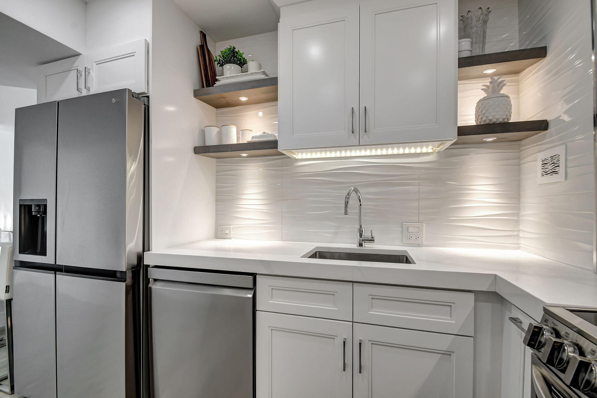 2840 South Ocean Boulevard, Unit 3020 Palm Beach, FL 33480 - Photo 14 of 40 a kitchen with a refrigerator and a sink