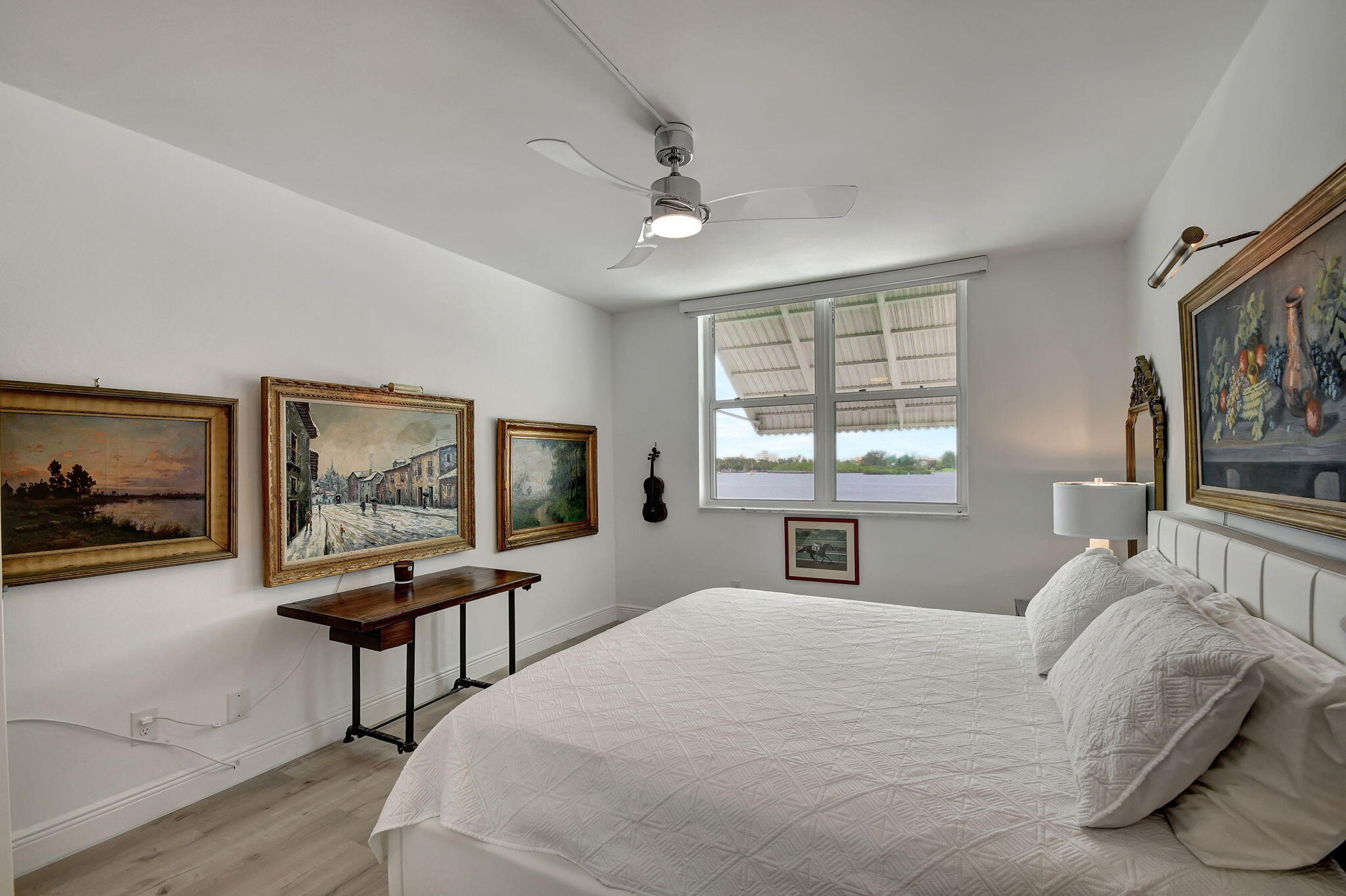 2840 South Ocean Boulevard, Unit 3020 Palm Beach, FL 33480 - Photo 18 of 40 a bedroom with a bed and a painting on the wall