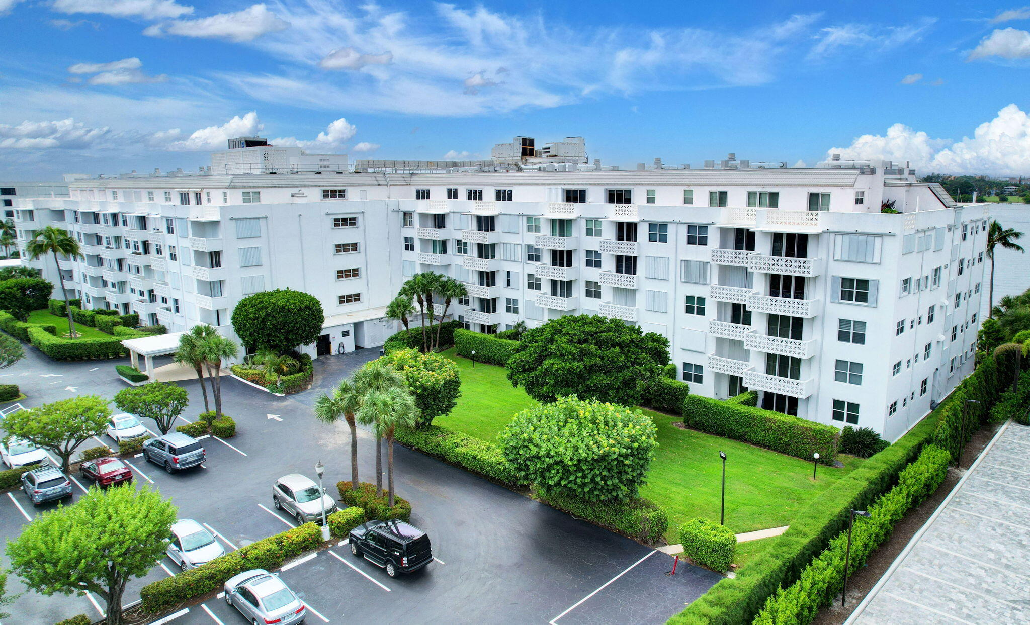 2840 South Ocean Boulevard, Unit 3020 Palm Beach, FL 33480 - Photo 24 of 40 a picture of a building with a garden and plants
