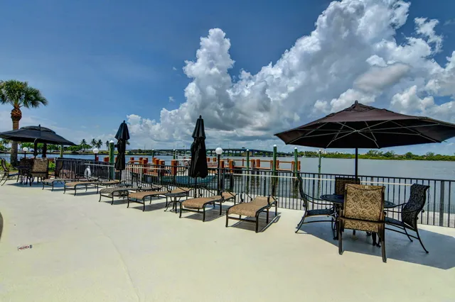 a view of a swimming pool with a lounge chairs