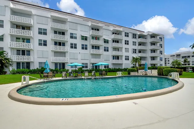 an aerial view of a house having outdoor space and swimming pool