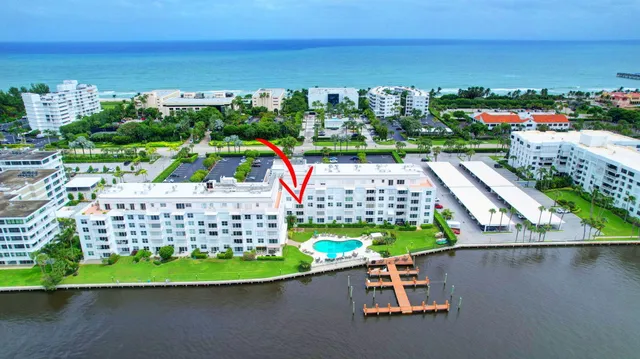 a aerial view of a house with a swimming pool outdoor seating
