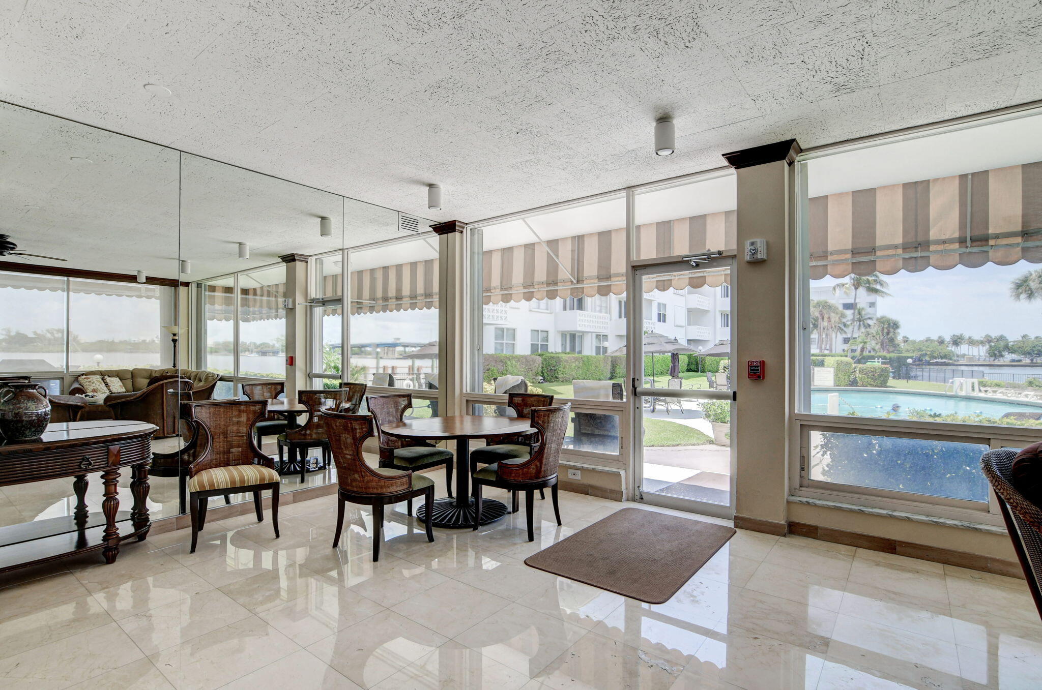 2840 South Ocean Boulevard, Unit 3020 Palm Beach, FL 33480 - Photo 34 of 40 a very nice looking living room with a large window and dining table