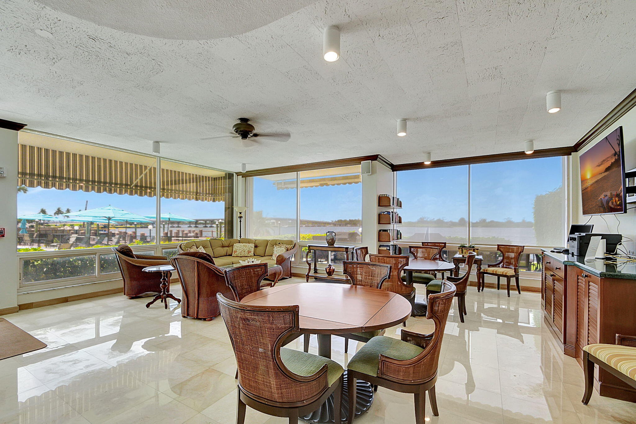 2840 South Ocean Boulevard, Unit 3020 Palm Beach, FL 33480 - Photo 35 of 40 a dining hall with stainless steel appliances a dining table and chairs