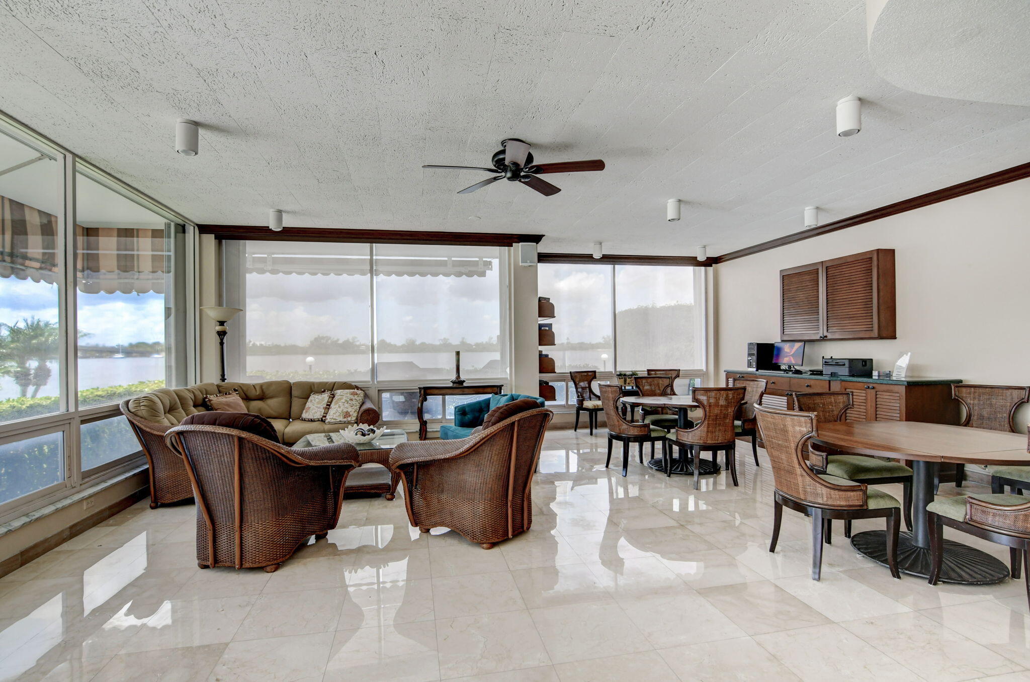 2840 South Ocean Boulevard, Unit 3020 Palm Beach, FL 33480 - Photo 36 of 40 a living room with furniture potted plant and a large window