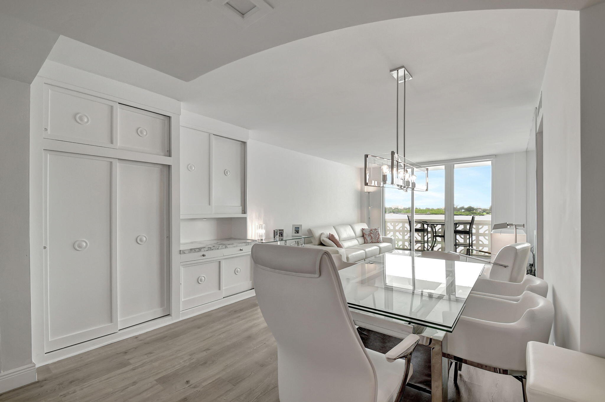 2840 South Ocean Boulevard, Unit 3020 Palm Beach, FL 33480 - Photo 9 of 40 a view of a dining room with furniture wooden floor and chandelier