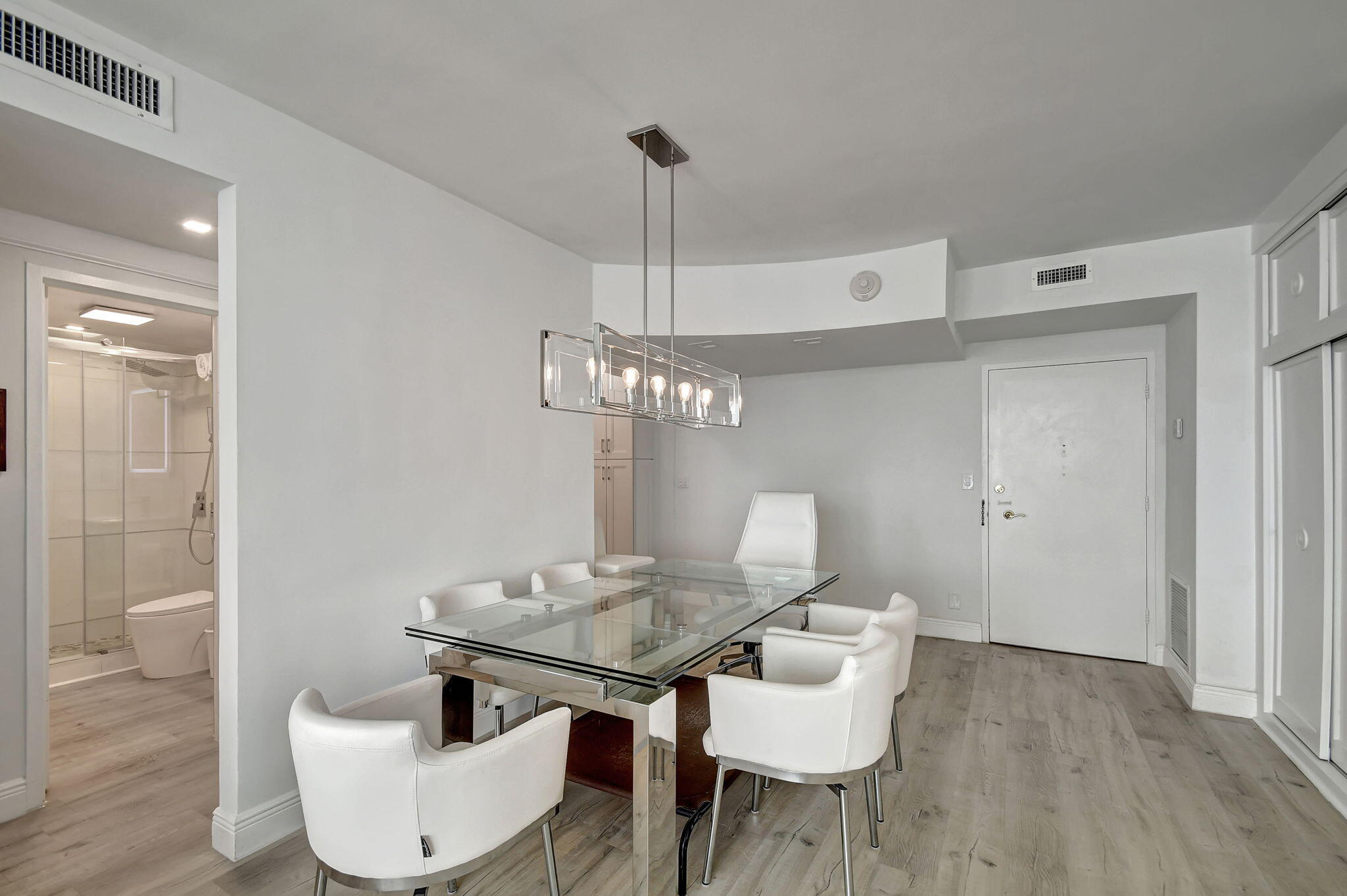 2840 South Ocean Boulevard, Unit 3020 Palm Beach, FL 33480 - Photo 10 of 40 a view of a dining room with furniture and wooden floor