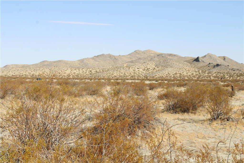 18-ac Lessing Avenue Adelanto, CA 92301 - Photo 4 of 17 a view of a large mountain with mountains in the background